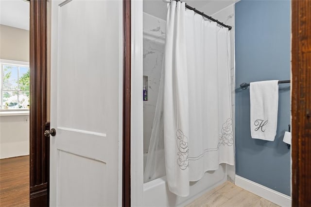 161 N Barton St, Norcross, GA 30071 - full bath featuring wood finished floors and shower / bath combo with shower curtain