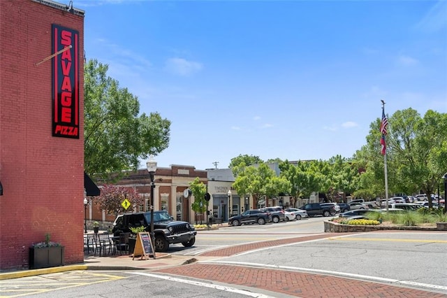161 N Barton St, Norcross, GA 30071 - view of asphalt street with street lights, curbs, sidewalks, and traffic signs