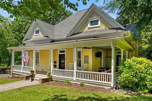 161 N Barton St, Norcross, GA 30071 - country-style home with a porch, a front yard, and roof with shingles