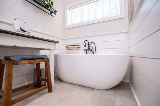 bathroom featuring a bathtub and tile patterned floors