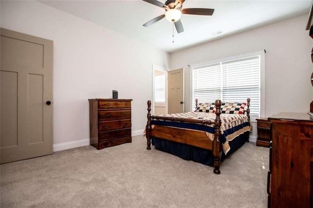 bedroom featuring ceiling fan and light carpet