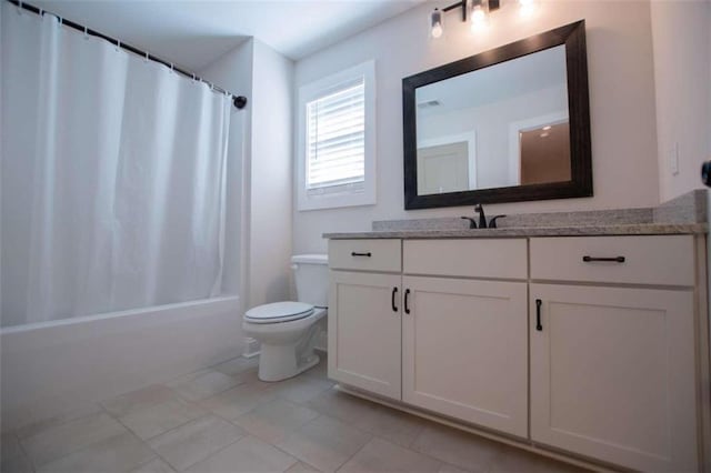 full bathroom with tile patterned flooring, toilet, shower / tub combo with curtain, and vanity