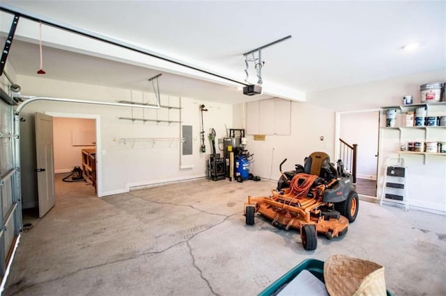 garage with a garage door opener and electric panel