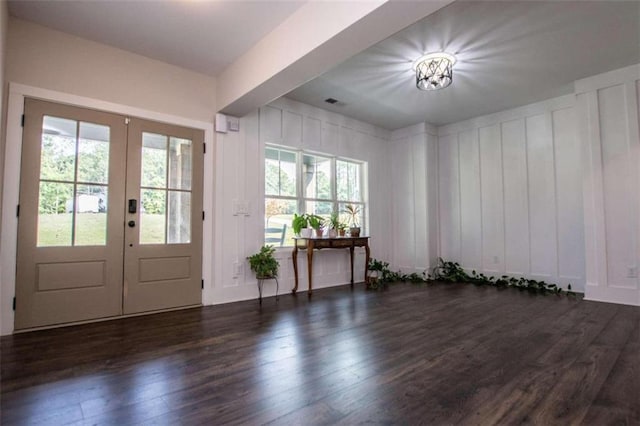 entryway featuring dark hardwood / wood-style flooring and french doors