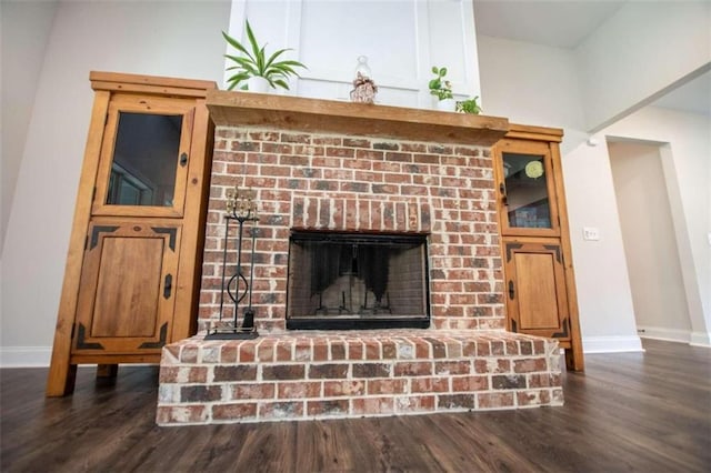 interior details featuring hardwood / wood-style flooring and a fireplace