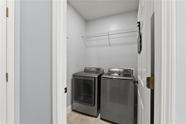 laundry area with washing machine and clothes dryer