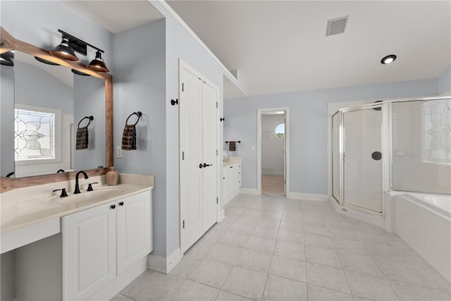 bathroom with tile patterned floors, vanity, shower with separate bathtub, and vaulted ceiling