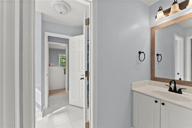 bathroom featuring tile patterned flooring and vanity