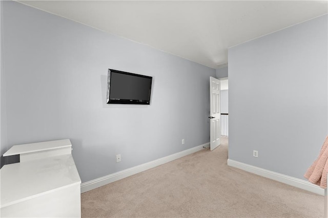 unfurnished bedroom with light colored carpet