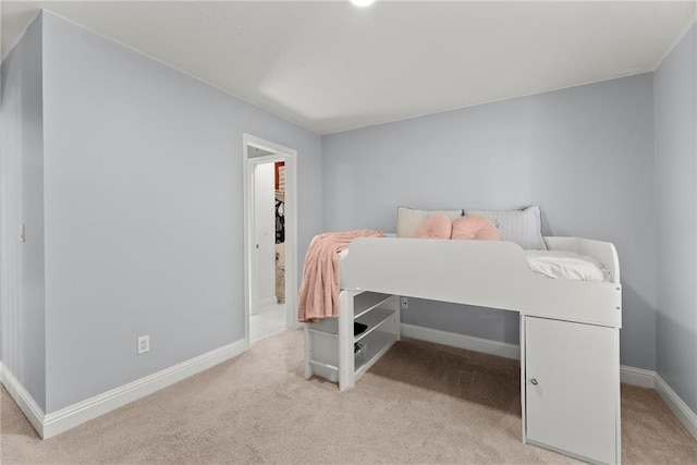 bedroom featuring light colored carpet