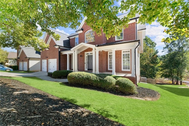 view of front facade featuring a front lawn and a garage