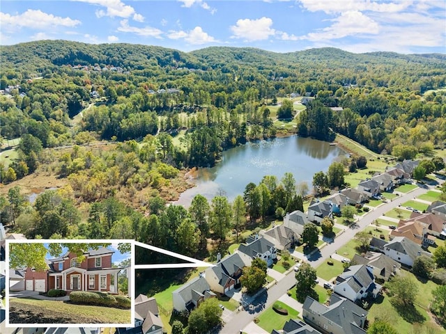 birds eye view of property featuring a water view