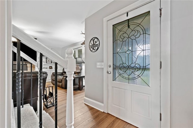 2545 Hickory Level Rd, Villa Rica, GA 30180 - entryway featuring wood finished floors, baseboards, and stairs