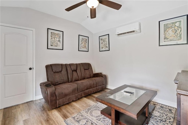 2545 Hickory Level Rd, Villa Rica, GA 30180 - living room with an AC wall unit, vaulted ceiling, a ceiling fan, light wood-style flooring, and baseboards