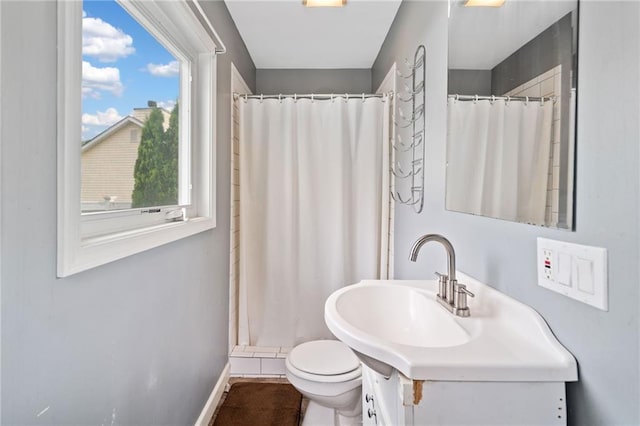 2545 Hickory Level Rd, Villa Rica, GA 30180 - bathroom featuring toilet, a shower with shower curtain, baseboards, and vanity