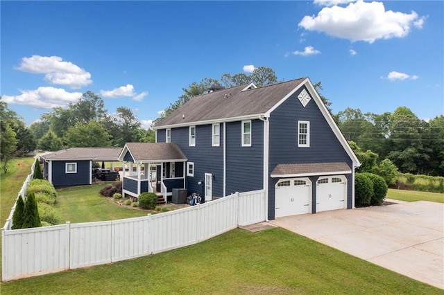 2545 Hickory Level Rd, Villa Rica, GA 30180 - view of side of property with concrete driveway, an attached garage, central air condition unit, and a shingled roof