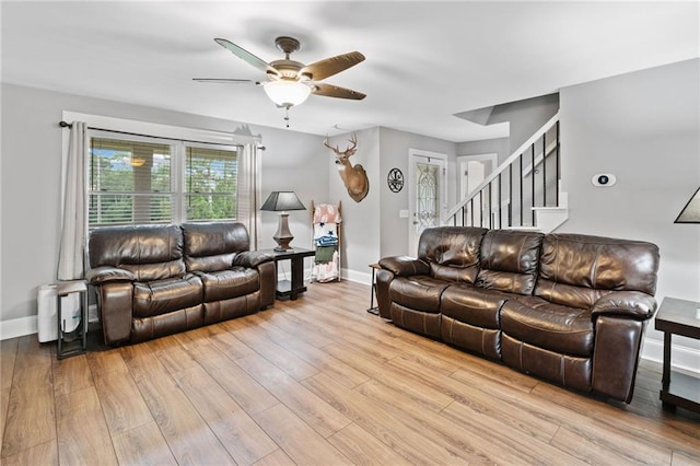 2545 Hickory Level Rd, Villa Rica, GA 30180 - living room with a ceiling fan, stairs, wood finished floors, and baseboards