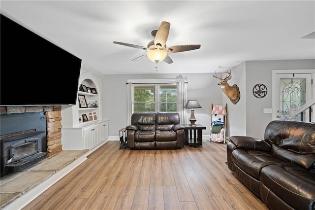 2545 Hickory Level Rd, Villa Rica, GA 30180 - living room with a ceiling fan, light wood-style floors, built in features, and baseboards