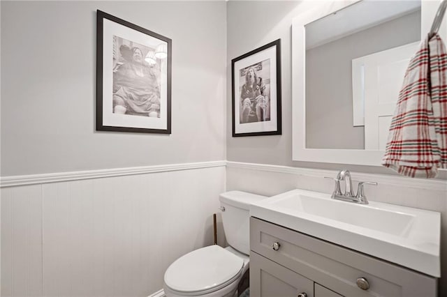 2545 Hickory Level Rd, Villa Rica, GA 30180 - bathroom featuring a wainscoted wall, toilet, and vanity