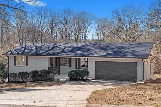 ranch-style house featuring a porch and a garage