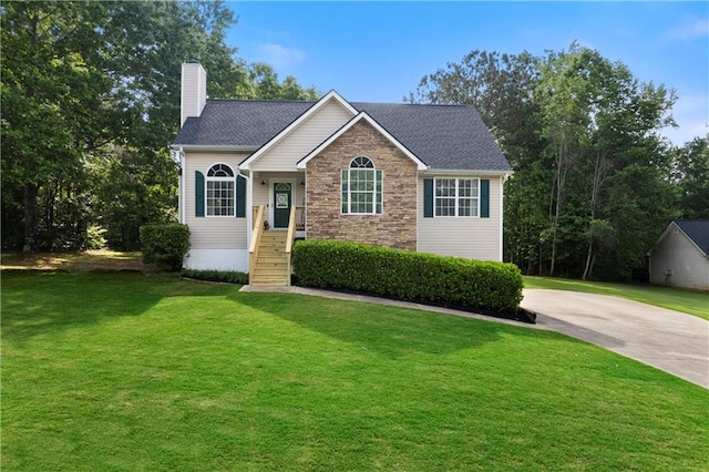 71 Headland Ct, Rockmart, GA 30153 - view of front facade featuring a chimney, a front yard, stone siding, and concrete driveway