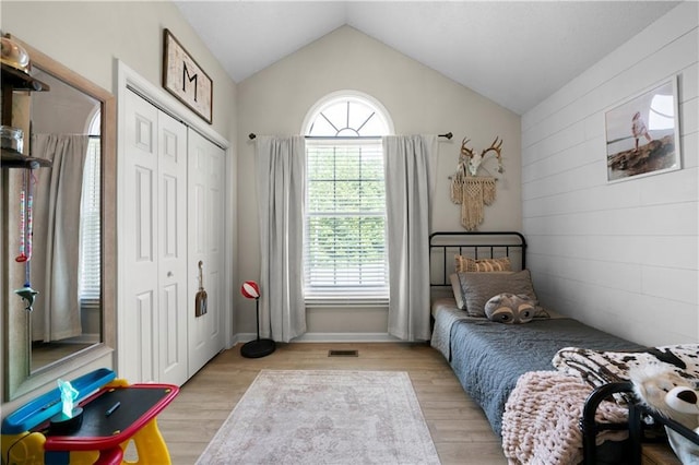 71 Headland Ct, Rockmart, GA 30153 - bedroom with vaulted ceiling, a closet, and light wood finished floors