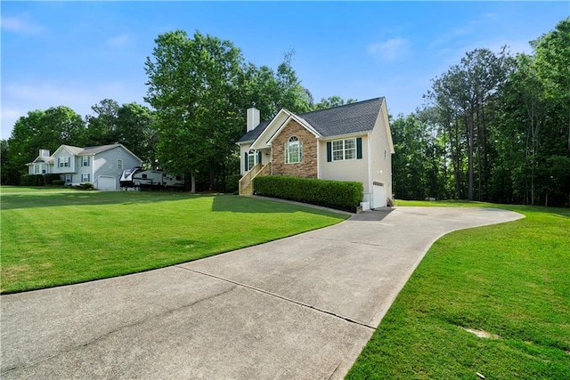 71 Headland Ct, Rockmart, GA 30153 - view of front of property featuring concrete driveway, a chimney, a front lawn, and an attached garage