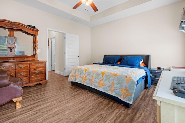 bedroom with wood-type flooring and ceiling fan