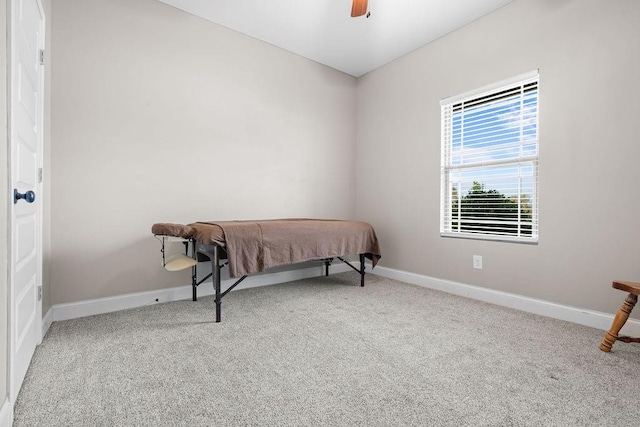 bedroom with light carpet and ceiling fan