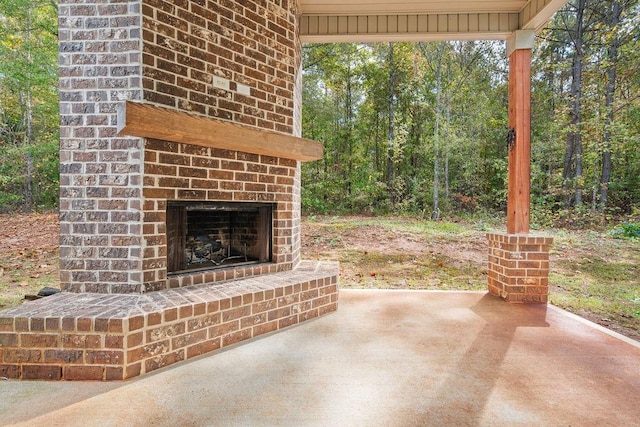 view of patio / terrace with an outdoor brick fireplace