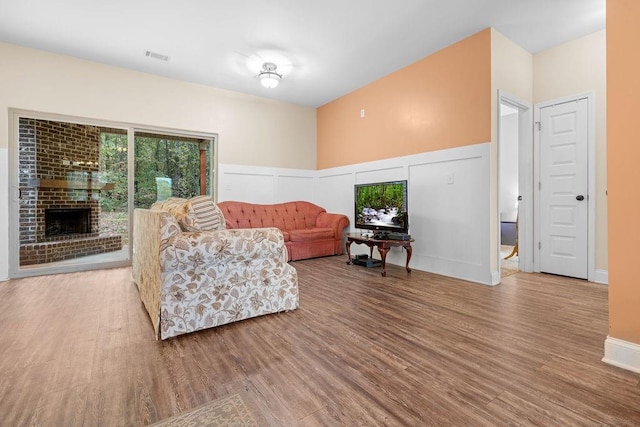 living room featuring a fireplace and hardwood / wood-style floors