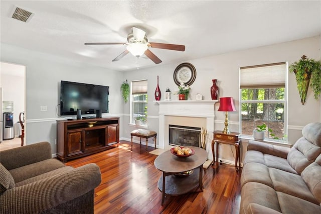 living room featuring ceiling fan and hardwood / wood-style floors