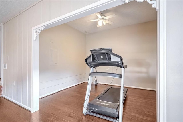 exercise room featuring hardwood / wood-style flooring and ceiling fan