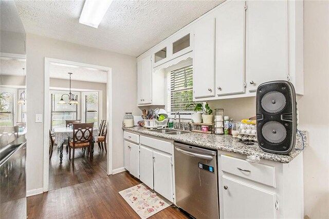 kitchen with dishwasher, dark wood-style flooring, a sink, and white cabinetry
