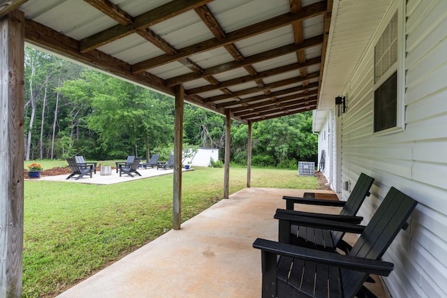 view of patio with a fire pit