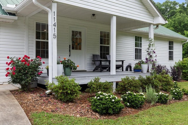 property entrance featuring covered porch