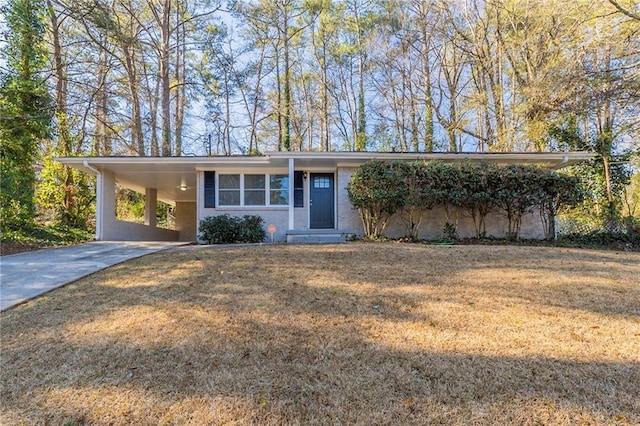 ranch-style home with a front lawn and a carport