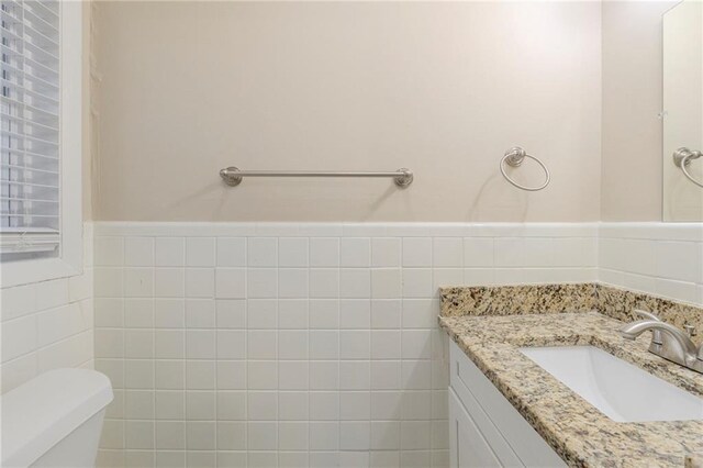 bathroom with toilet and vanity