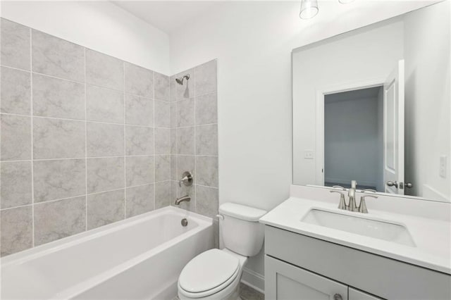 bathroom with toilet, vanity, and shower / washtub combination