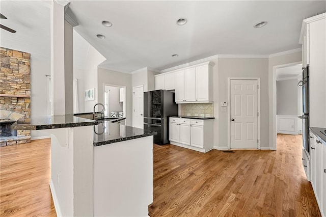 4440 Green Summers Dr, Cumming, GA 30028 - kitchen featuring freestanding refrigerator, ornamental molding, white cabinets, decorative backsplash, and light wood-type flooring