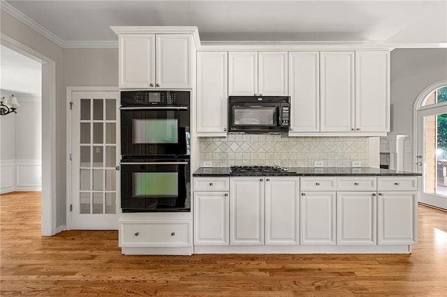4440 Green Summers Dr, Cumming, GA 30028 - kitchen featuring black appliances, ornamental molding, white cabinetry, light wood-style floors, and backsplash