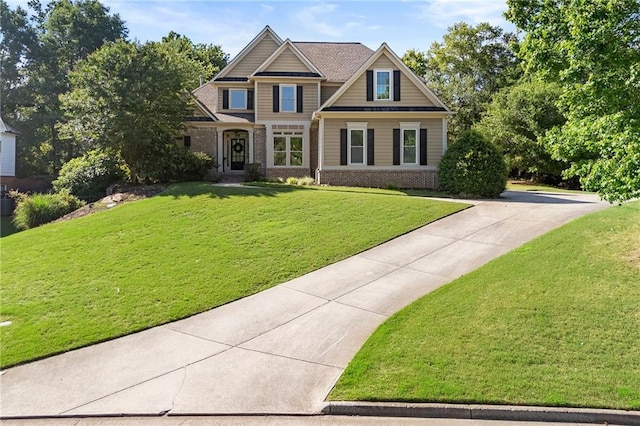 4440 Green Summers Dr, Cumming, GA 30028 - craftsman-style house with brick siding, a front yard, and driveway