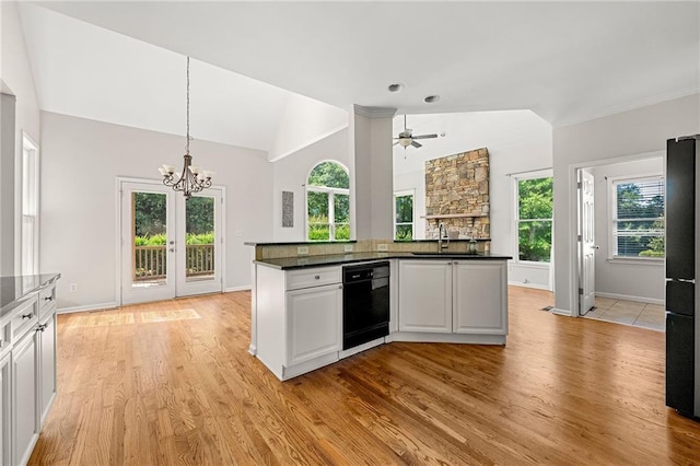 4440 Green Summers Dr, Cumming, GA 30028 - kitchen featuring black appliances, a sink, dark countertops, a chandelier, and light wood finished floors