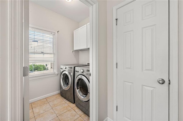 4440 Green Summers Dr, Cumming, GA 30028 - laundry area featuring cabinet space, separate washer and dryer, baseboards, and light tile patterned flooring