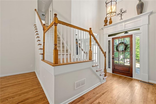 4440 Green Summers Dr, Cumming, GA 30028 - foyer with wood finished floors, baseboards, a towering ceiling, and stairway