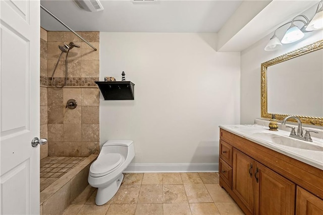 4440 Green Summers Dr, Cumming, GA 30028 - bathroom featuring vanity, toilet, a tile shower, and baseboards