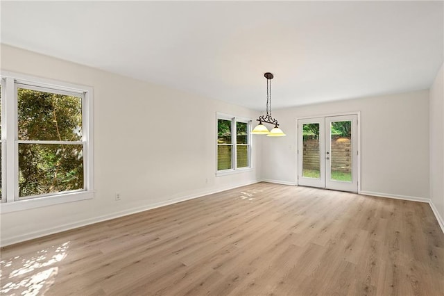 4440 Green Summers Dr, Cumming, GA 30028 - empty room featuring light wood-style flooring, baseboards, and french doors