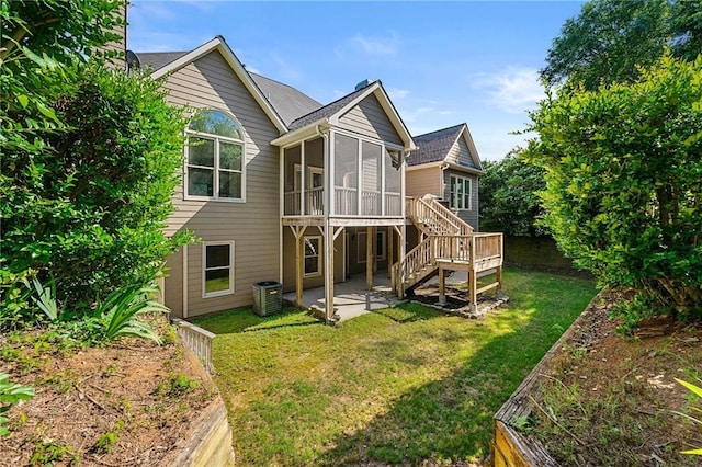 4440 Green Summers Dr, Cumming, GA 30028 - back of property with a sunroom, a patio, stairway, central AC, and a lawn