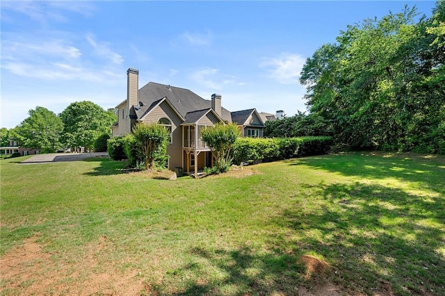 4440 Green Summers Dr, Cumming, GA 30028 - view of side of home with a yard and a chimney