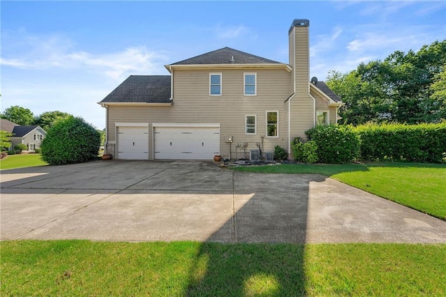 4440 Green Summers Dr, Cumming, GA 30028 - back of property with concrete driveway, a lawn, a chimney, an attached garage, and cooling unit